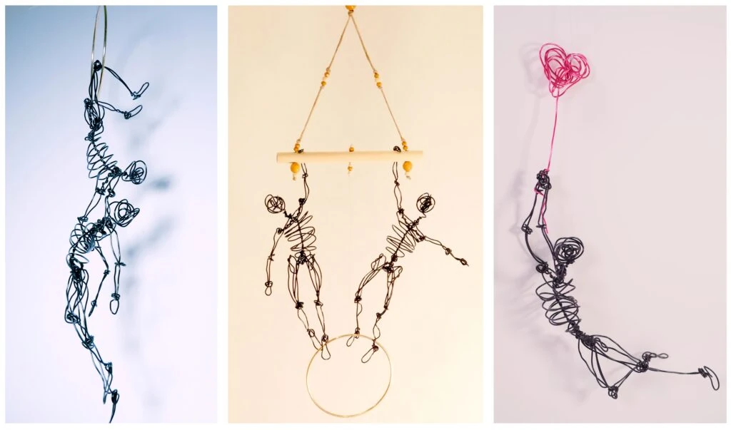 Composiciones de figuras de alambre suspendidas: acróbatas, un móvil y una figura con un globo